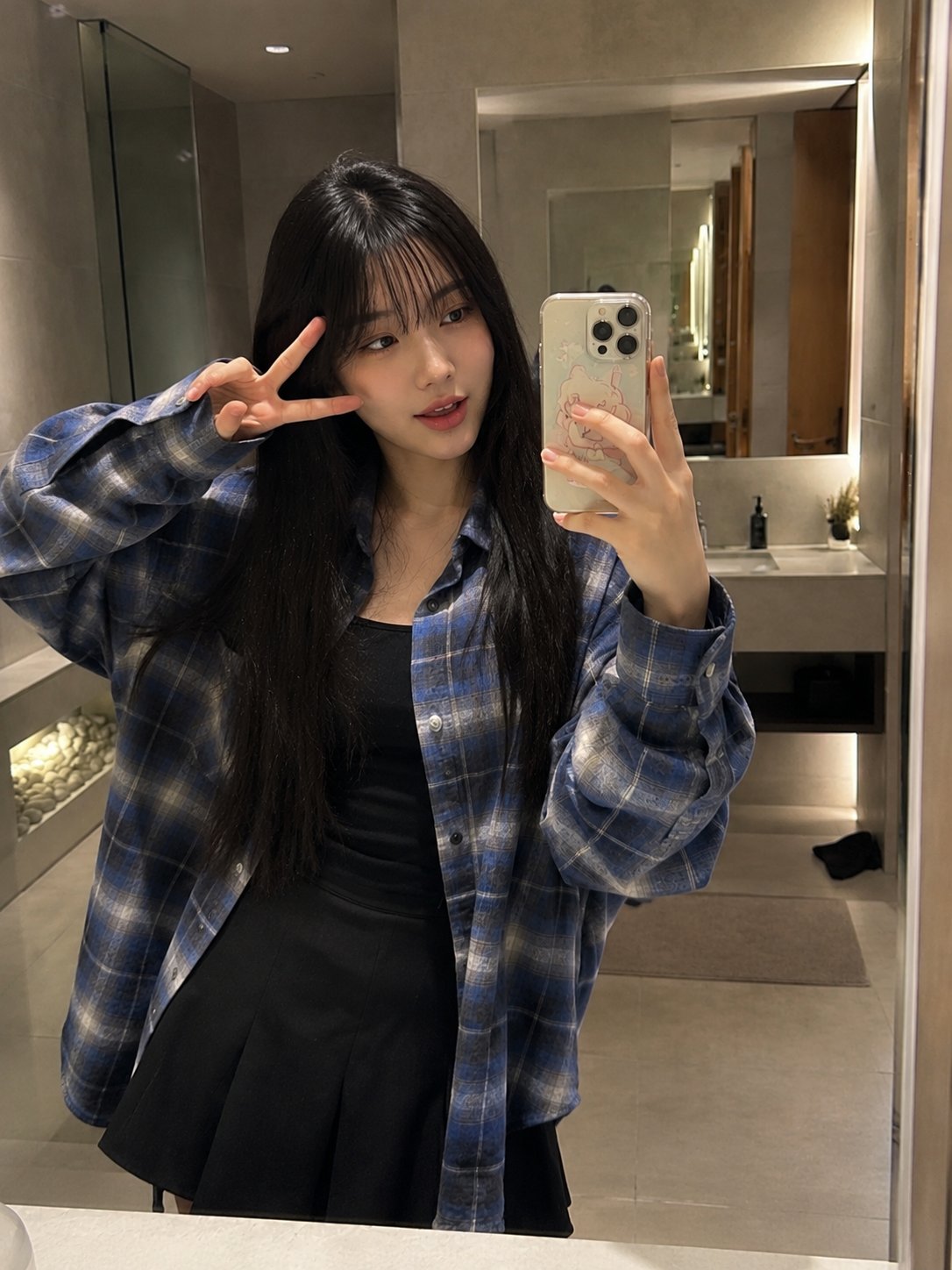 Beautiful young Japanese woman with long straight black hair and soft wispy bang