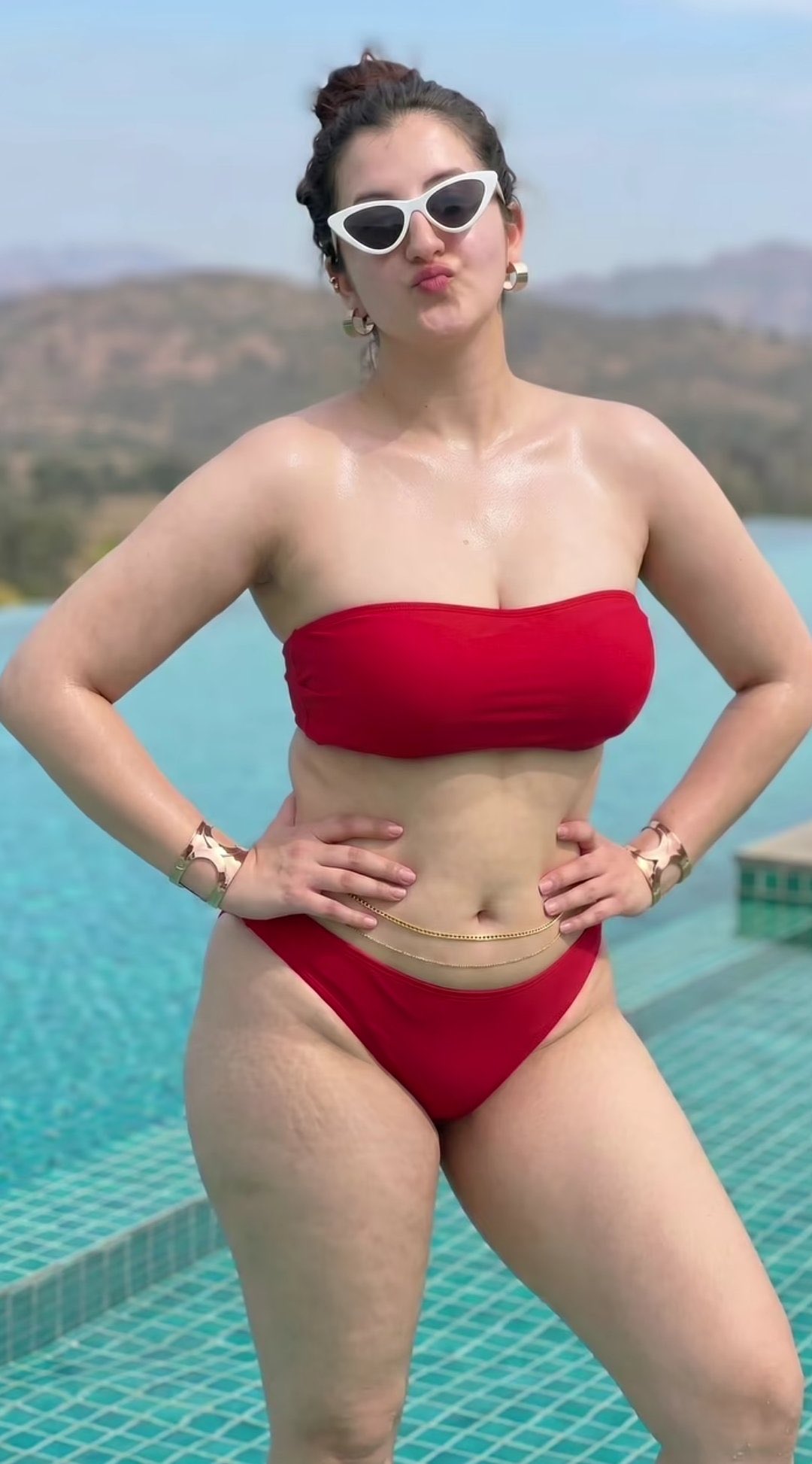 A stunning photorealistic portrait of a confident curvy Indian woman standing po